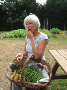 Karin Grainger with basket of home grown veggies